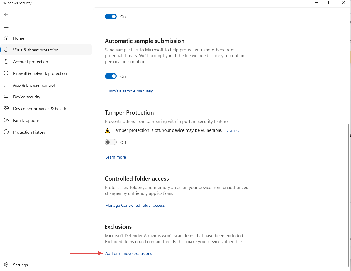 Windows Security settings scrolled to the Exclusions section, red arrow pointing at Add or remove exclusions